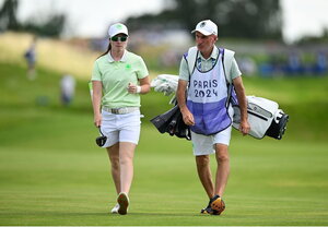 7 August 2024; Leona Maguire of Team Ireland with caddie Verners Tess during round one of the women's individual strokeplay at Le Golf National during the 2024 Paris Summer Olympic Games in Paris, France. Photo by Brendan Moran/Sportsfile