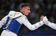 7 August 2024; Jack Woolley of Team Ireland shakes hands with Adrian Vincente Yunta of Team Spain after his defeat in the men's -58kg Repechage at the Grand Palais during the 2024 Paris Summer Olympic Games in Paris, France. Photo by Stephen McCarthy/Sportsfile