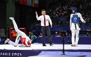 7 August 2024; Jack Woolley of Team Ireland, right, in action against Adrian Vincente Yunta of Team Spain during the men's -58kg Repechage at the Grand Palais during the 2024 Paris Summer Olympic Games in Paris, France. Photo by Stephen McCarthy/Sportsfile