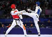 7 August 2024; Jack Woolley of Team Ireland, right, in action against Adrian Vincente Yunta of Team Spain during the men's -58kg Repechage at the Grand Palais during the 2024 Paris Summer Olympic Games in Paris, France. Photo by Stephen McCarthy/Sportsfile