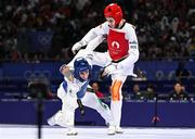 7 August 2024; Jack Woolley of Team Ireland, left, in action against Adrian Vincente Yunta of Team Spain during the men's -58kg Repechage at the Grand Palais during the 2024 Paris Summer Olympic Games in Paris, France. Photo by Stephen McCarthy/Sportsfile