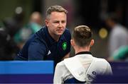7 August 2024; Team Ireland taekwondo coach Robert Taaffe, speaks to Jack Woolley of Team Ireland after his men's 59kg Repecage match against Adrian Vincente Yunta of Team Spain at the Grand Palais during the 2024 Paris Summer Olympic Games in Paris, France. Photo by Stephen McCarthy/Sportsfile