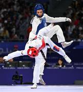 7 August 2024; Yohandri Granado of Team Venezuela, left, in action against Cyrian Ravet of Team France during the men's -58kg Repechage at the Grand Palais during the 2024 Paris Summer Olympic Games in Paris, France. Photo by Stephen McCarthy/Sportsfile