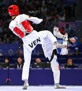 7 August 2024; Yohandri Granado of Team Venezuela, left, in action against Cyrian Ravet of Team France during the men's -58kg Repechage at the Grand Palais during the 2024 Paris Summer Olympic Games in Paris, France. Photo by Stephen McCarthy/Sportsfile
