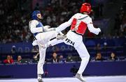 7 August 2024; Cyrian Ravet of Team France, left, in action against Yohandri Granado of Team Venezuela during the men's -58kg Repechage at the Grand Palais during the 2024 Paris Summer Olympic Games in Paris, France. Photo by Stephen McCarthy/Sportsfile