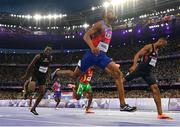 7 August 2024; Quincy Hall of Team USA, centre, crosses the finish line to win the men's 400m final at the Stade de France during the 2024 Paris Summer Olympic Games in Paris, France. Photo by Sam Barnes/Sportsfile