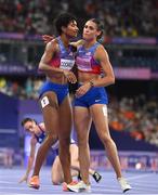 8 August 2024; Sydney McLaughlin-Levrone of Team United States is congratulated by teammate and silver medallist Anna Cockrell, left, after winning gold in the women's 400m hurdlesat the Stade de France during the 2024 Paris Summer Olympic Games in Paris, France. Photo by Sam Barnes/Sportsfile