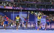 8 August 2024; Grant Holloway of Team United States, centre, dips for the line to win gold in the men's 110m hurdles finalat the Stade de France during the 2024 Paris Summer Olympic Games in Paris, France. Photo by Sam Barnes/Sportsfile