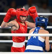 8 August 2024; Yuan Chang of Team China, left, in action against Hatice Akbas of Team Turkey during their women's 54kg final bout at Court Philippe-Chatrier in Roland Garros Stadium duringduring the 2024 Paris Summer Olympic Games in Paris, France. Photo by Stephen McCarthy/Sportsfile