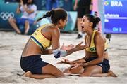 8 August 2024; Duda Lisboa, right, and Ana Patrícia of Team Brazil celebrate after the women's beach volleyball semi final match between Team Brazil and Team Australia at the Eiffel Tower Stadium during the 2024 Paris Summer Olympic Games in Paris, France. Photo by David Fitzgerald/Sportsfile