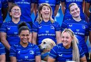 9 August 2024; Leinster players, back row, from left, Aimee Clarke, Ailsa Hughes, Cara Martin, with, front row, Eimear Corri, left, and Aoife Dalton, alongside TJ the Dog, centre, during the Leinster Rugby women's jersey presentation at Energia Park in Dublin. Photo by Shauna Clinton/Sportsfile