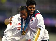 9 August 2024; Silver medalist Salwa Eid Naser of Team Bahrain, left, is embraced by Gold medalist Marileidy Paulino of Team Dominican Republic during the victory ceremony for the women's 400m at the Stade de France during the 2024 Paris Summer Olympic Games in Paris, France. Photo by Brendan Moran/Sportsfile