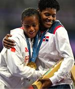 9 August 2024; Silver medalist Salwa Eid Naser of Team Bahrain, left, is embraced by Gold medalist Marileidy Paulino of Team Dominican Republic during the victory ceremony for the women's 400m at the Stade de France during the 2024 Paris Summer Olympic Games in Paris, France. Photo by Brendan Moran/Sportsfile