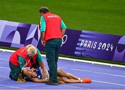 9 August 2024; Alessia Zarbo of Team France receives medical attention during the women's 10000m final at the Stade de France during the 2024 Paris Summer Olympic Games in Paris, France. Photo by Brendan Moran/Sportsfile