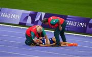 9 August 2024; Alessia Zarbo of Team France receives medical attention during the women's 10000m final at the Stade de France during the 2024 Paris Summer Olympic Games in Paris, France. Photo by Brendan Moran/Sportsfile