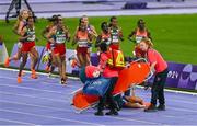 9 August 2024; Alessia Zarbo of Team France receives medical attention during the women's 10000m final at the Stade de France during the 2024 Paris Summer Olympic Games in Paris, France. Photo by Brendan Moran/Sportsfile