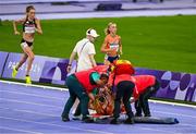 9 August 2024; Alessia Zarbo of Team France receives medical attention during the women's 10000m final at the Stade de France during the 2024 Paris Summer Olympic Games in Paris, France. Photo by Brendan Moran/Sportsfile