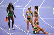 10 August 2024; The Team Ireland relay team, from left, Rhasidat Adeleke, Sophie Becker, Phil Healy, and Sharlene Mawdsley react after finishing fourth in the women's 4 x 400m relay final at the Stade de France during the 2024 Paris Summer Olympic Games in Paris, France. Photo by Brendan Moran/Sportsfile