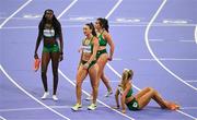 10 August 2024; The Team Ireland relay team, from left, Rhasidat Adeleke, Sophie Becker, Phil Healy, and Sharlene Mawdsley react after finishing fourth in the women's 4 x 400m relay final at the Stade de France during the 2024 Paris Summer Olympic Games in Paris, France. Photo by Brendan Moran/Sportsfile