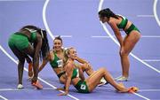 10 August 2024; The Team Ireland relay team, from left, Rhasidat Adeleke, Sophie Becker, Sharlene Mawdsley and Phil Healy react after finishing fourth in the women's 4 x 400m relay final at the Stade de France during the 2024 Paris Summer Olympic Games in Paris, France. Photo by Brendan Moran/Sportsfile
