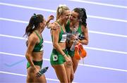 10 August 2024; Sharlene Mawdsley of Team Ireland is consoled by Phil Healy, right, and Sophie Becker after the women's 4 x 400m relay final at the Stade de France during the 2024 Paris Summer Olympic Games in Paris, France. Photo by Brendan Moran/Sportsfile