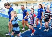 10 August 2024; Leinster players, from left, Cara Martin, Aoife Dalton and Aimee Clarke with match day mascots before the Vodafone Women’s Interprovincial Championship Round One match between Leinster and Connacht at Energia Park in Dublin. Photo by Seb Daly/Sportsfile