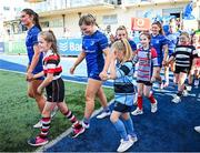 10 August 2024; Leinster players, from left, Ella Roberts, Cara Martin, Aoife Dalton and Aimee Clarke with match day mascots before the Vodafone Women’s Interprovincial Championship Round One match between Leinster and Connacht at Energia Park in Dublin. Photo by Seb Daly/Sportsfile
