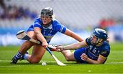 11 August 2024; Laura Shinners of Tipperary in action against Leah Daly of Laois during the All-Ireland Premier Junior Camogie Championship final between Laois and Tipperary at Croke Park in Dublin. Photo by Piaras Ó Mídheach/Sportsfile