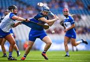 11 August 2024; Laura Shinners of Tipperary in action against Leah Daly of Laois during the All-Ireland Premier Junior Camogie Championship final between Laois and Tipperary at Croke Park in Dublin. Photo by Piaras Ó Mídheach/Sportsfile