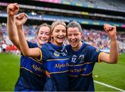 11 August 2024; Tipperary players, from left, Gemma Fox, Amy Callanan and Grace Moloney celebrate after their side's victory in the All-Ireland Premier Junior Camogie Championship final between Laois and Tipperary at Croke Park in Dublin. Photo by Piaras Ó Mídheach/Sportsfile
