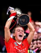 11 August 2024; Cork captain Lauren Homan lifts the Jack McGrath Cup after her side's victory in the All-Ireland Premier Intermediate Camogie Championship final between Cork and Kilkenny at Croke Park in Dublin. Photo by Piaras Ó Mídheach/Sportsfile
