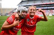11 August 2024; Cork players Olivia McAllen, left, and Orla Keating celebrate after their side's victory in the All-Ireland Premier Intermediate Camogie Championship final between Cork and Kilkenny at Croke Park in Dublin. Photo by Piaras Ó Mídheach/Sportsfile
