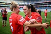 11 August 2024; Cork players Laura Treacy, left, and Sorcha McCartan celebrate after their side's victory in the Glen Dimplex Camogie All-Ireland Senior Camogie Championship final between Cork and Galway at Croke Park in Dublin. Photo by Piaras Ó Mídheach/Sportsfile