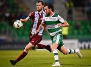 11 August 2024; Marc McNulty of Shamrock Rovers in action against Andrew Quinn of Drogheda United during the SSE Airtricity Men's Premier Division match between Shamrock Rovers and Drogheda United at Tallaght Stadium in Dublin. Photo by Harry Murphy/Sportsfile