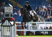 14 August 2024; Erica Swartz Ryan of Sweden competing on Cavicii Z in the Sport Ireland Classic during the Dublin Horse Show 2024 at the RDS in Dublin. Photo by Shauna Clinton/Sportsfile