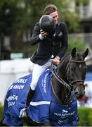 14 August 2024; Darragh Kenny of Ireland acknowledges the crowd after his victory in the Sport Ireland Classic during the Dublin Horse Show 2024 at the RDS in Dublin. Photo by Shauna Clinton/Sportsfile