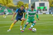 15 August 2024; Trevor Clarke of Shamrock Rovers in action against David Zec of Celje during the UEFA Europa League third qualifying round second leg match between Shamrock Rovers and Celje at Tallaght Stadium in Dublin. Photo by Ben McShane/Sportsfile