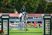 16 August 2024; Darragh Kenny of Ireland, competing on VDL Cartello, during Aga Khan Day at the Dublin Horse Show at the RDS Arena in Dublin. Photo by David Fitzgerald/Sportsfile