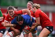 17 August 2024; Hannah O'Connor of Leinster in action against Jane Clohessy, left, and Aoife Corey of Munster during the Vodafone Women’s Interprovincial Championship Round Two match between Munster and Leinster at Virgin Media Park in Cork. Photo by Shauna Clinton/Sportsfile