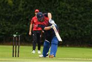 22 August 2024; Paul Stirling of Northern Knights loses his wicket to the bowling of Liam McCarthy of Munster Reds during the Cricket Ireland Inter-Provincial Cup match between Munster Reds and Northern Knights at The Mardyke in Cork. Photo by Matt Browne/Sportsfile