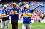 4 August 2024; Mary Power O’Shea, from Mullinahone, of the Tipperary team of 1974, who won the first All-Ireland Ladies Senior Football Championship final, as they are introduced to the crowd at half-time during the TG4 All-Ireland Ladies Football Intermediate Championship final match between Leitrim and Tyrone at Croke Park in Dublin. Photo by Piaras Ó Mídheach/Sportsfile