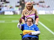 4 August 2024; Alice Morris from Moycarkey, of the Tipperary team of 1974, who won the first All-Ireland Ladies Senior Football Championship final, as they are introduced to the crowd at half-time during the TG4 All-Ireland Ladies Football Intermediate Championship final match between Leitrim and Tyrone at Croke Park in Dublin. Photo by Piaras Ó Mídheach/Sportsfile