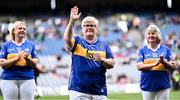 4 August 2024; Cáit O’Dwyer, from Moycarkey, of the Tipperary team of 1974, who won the first All-Ireland Ladies Senior Football Championship final, as they are introduced to the crowd at half-time during the TG4 All-Ireland Ladies Football Intermediate Championship final match between Leitrim and Tyrone at Croke Park in Dublin. Photo by Piaras Ó Mídheach/Sportsfile