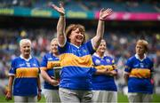 4 August 2024; Josie Keane, from Mullinahone, of the Tipperary team of 1974, who won the first All-Ireland Ladies Senior Football Championship final, as they are introduced to the crowd at half-time during the TG4 All-Ireland Ladies Football Intermediate Championship final match between Leitrim and Tyrone at Croke Park in Dublin. Photo by Seb Daly/Sportsfile