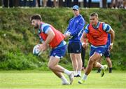 23 August 2024; Head coach Leo Cullen watches Harry Byrne, left, in action during a Leinster Rugby squad open training session at New Ross RFC in Wexford. Photo by Seb Daly/Sportsfile