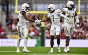 24 August 2024; Georgia Tech Yellow Jackets defensive backs Ahmari Harvey, left, and Taye Seymore celebrate a turnover during the 2024 Aer Lingus College Football Classic match between Florida State and Georgia Tech at Aviva Stadium in Dublin. Photo by Ben McShane/Sportsfile