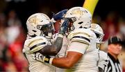 24 August 2024; Georgia Tech Yellow Jackets running back Jamal Haynes celebrates with Jordan Brown after scoring their side's third touchdown during the 2024 Aer Lingus College Football Classic match between Florida State and Georgia Tech at Aviva Stadium in Dublin. Photo by Brendan Moran/Sportsfile