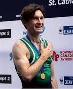 24 August 2024; Paul O'Donovan of Ireland stands for Amhrán na bhFiann with his gold medal after winning the lightweight men's single sculls final at the World Rowing Championships at Royal Canadian Henley Rowing Course in St Catharines, Canada. Photo by Stephen Leithwood/Sportsfile