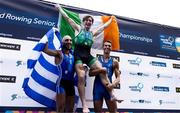 24 August 2024; Paul O'Donovan of Ireland celebrates on the podium with Antonios Papakonstantinou of Greece, and Niels Torre of Italy after the lightweight men's single sculls final at the World Rowing Championships at Royal Canadian Henley Rowing Course in St Catharines, Canada. Photo by Stephen Leithwood/Sportsfile