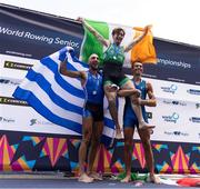 24 August 2024; Paul O'Donovan of Ireland celebrates on the podium with Antonios Papakonstantinou of Greece, and Niels Torre of Italy after the lightweight men's single sculls final at the World Rowing Championships at Royal Canadian Henley Rowing Course in St Catharines, Canada. Photo by Stephen Leithwood/Sportsfile